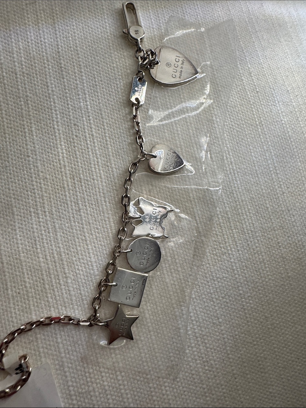 Gucci Silver-Tone Charm Bracelet with Assorted Logo Charms